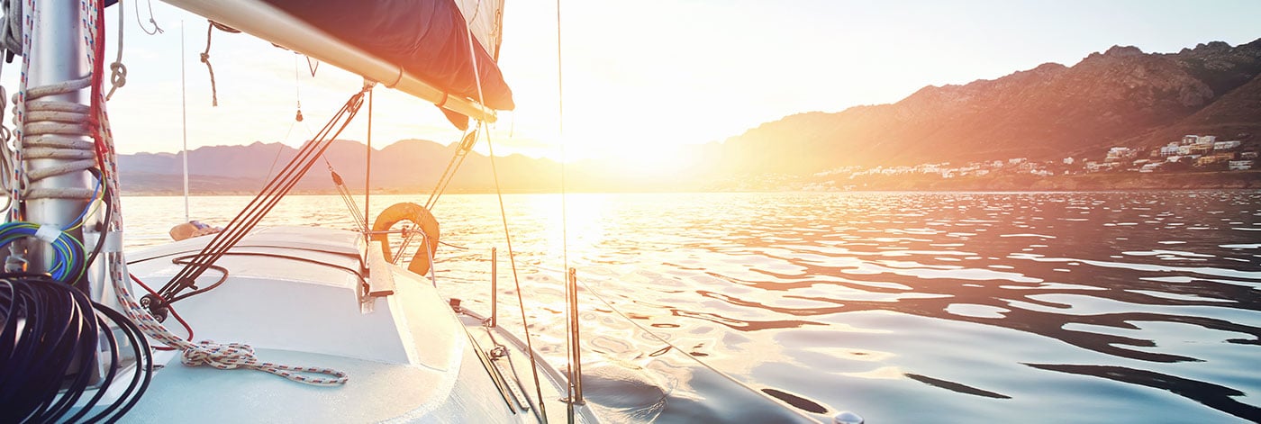 Boat out on water with bright sun