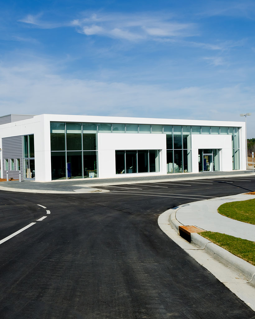 Large dealership building with glass walls