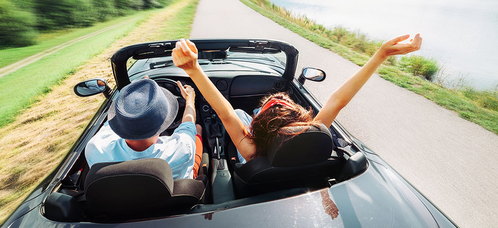Young couple in black Convertible